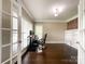 Bright office space with hardwood floors, built-in shelves, and French doors at 2652 Bedford Nw Pl, Concord, NC 28027