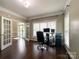 Well-lit office featuring hardwood floors, white trim, and view to the foyer at 2652 Bedford Nw Pl, Concord, NC 28027