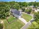 Aerial view of home with large yard, mature trees and neighborhood at 3004 Marlowe Ave, Charlotte, NC 28208