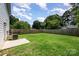 A large back yard features a wooden fence and lush green grass at 3004 Marlowe Ave, Charlotte, NC 28208