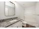 The full bathroom is complete with granite counters and a tub shower at 3004 Marlowe Ave, Charlotte, NC 28208