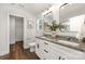 Bright bathroom with double vanity, granite counters, and view into the shower at 3004 Marlowe Ave, Charlotte, NC 28208