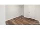 The bedroom features wood-look flooring, neutral walls, and two doors at 3004 Marlowe Ave, Charlotte, NC 28208