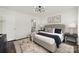 Spacious bedroom with neutral decor, a large bed, and modern light fixture at 3004 Marlowe Ave, Charlotte, NC 28208