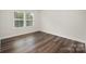 A small bedroom features two large windows that provide natural light and wood floor at 3004 Marlowe Ave, Charlotte, NC 28208