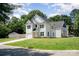 Charming two-story home with white siding, well-manicured lawn and attached garage at 3004 Marlowe Ave, Charlotte, NC 28208