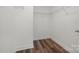 Walk-in closet with hardwood floors and wire shelving ready to be filled at 3004 Marlowe Ave, Charlotte, NC 28208