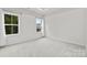 Bright, carpeted bedroom with two windows and ample natural light at 416 Dalton Cir, Fort Mill, SC 29715