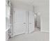 Bedroom featuring an open door to a hallway with additional doors and a window at 416 Dalton Cir, Fort Mill, SC 29715