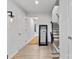 Bright entryway features wood floors, staircase, decorative mirror, and access to other rooms at 416 Dalton Cir, Fort Mill, SC 29715