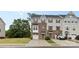 Exterior view of charming two-story townhomes with well-manicured lawns and inviting driveways at 416 Dalton Cir, Fort Mill, SC 29715