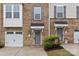Charming brick townhome featuring a well maintained front yard and an attached garage at 416 Dalton Cir, Fort Mill, SC 29715