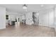 Bright, open-concept living area with modern flooring and staircase at 416 Dalton Cir, Fort Mill, SC 29715