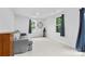 Bright living room has plush carpet, two windows, and neutral decor at 416 Dalton Cir, Fort Mill, SC 29715