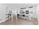 Open-concept kitchen and living area featuring sleek island seating and ample natural light at 416 Dalton Cir, Fort Mill, SC 29715