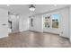 Bright, open living room featuring large windows and light wood floors at 416 Dalton Cir, Fort Mill, SC 29715