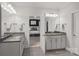 Well-lit bathroom boasts double sinks and a doorway leading to the main bedroom at 4311 Sheffield Park Ave, Charlotte, NC 28211