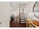 Elegant foyer with hardwood floors, staircase, and decorative molding, setting a sophisticated tone at 4311 Sheffield Park Ave, Charlotte, NC 28211