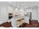 Beautiful kitchen featuring stainless steel appliances, granite countertops, and stylish pendant lighting at 4311 Sheffield Park Ave, Charlotte, NC 28211