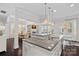 Open concept kitchen with a large granite island, seamlessly connecting to the dining and living areas at 4311 Sheffield Park Ave, Charlotte, NC 28211