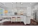 Modern kitchen featuring white cabinets, granite countertops, and stainless steel appliances at 4311 Sheffield Park Ave, Charlotte, NC 28211
