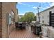 Relaxing outdoor patio with BBQ grill, table, and string lights for evening entertaining at 4311 Sheffield Park Ave, Charlotte, NC 28211
