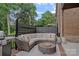 Relaxing patio with wicker seating and a grill perfect for outdoor entertainment and dining at 4311 Sheffield Park Ave, Charlotte, NC 28211