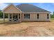 View of the backyard featuring a covered patio, offering an ideal spot for outdoor seating and enjoying the landscape at 4949 Rimer Rd # 4, Concord, NC 28025