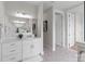 A bathroom is bright with a double vanity, large mirror and tiled floor and a neutral palette at 4949 Rimer Rd # 4, Concord, NC 28025