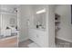 Elegant bathroom features white cabinets, stone countertops, and a large mirror at 4949 Rimer Rd # 4, Concord, NC 28025