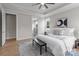 Tranquil bedroom featuring a tray ceiling, natural light, stylish decor, and an ensuite bathroom at 4949 Rimer Rd # 4, Concord, NC 28025