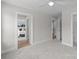 Neutral bedroom showcasing plush carpet, bright trim, and connecting room with a queen bed at 4949 Rimer Rd # 4, Concord, NC 28025