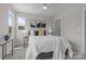 Bright bedroom with large windows, ceiling fan, and stylish decor at 4949 Rimer Rd # 4, Concord, NC 28025