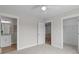 Bright bedroom featuring a ceiling fan and doors to bathroom and closet at 4949 Rimer Rd # 4, Concord, NC 28025