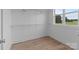 Bright walk-in closet with wire shelving, vinyl floors, and a large window at 4949 Rimer Rd # 4, Concord, NC 28025