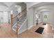 Home entryway with stairs and an open floor plan connecting the kitchen and living room at 4949 Rimer Rd # 4, Concord, NC 28025