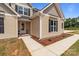 Charming home features a well-manicured lawn and a welcoming front entrance with covered porch at 4949 Rimer Rd # 4, Concord, NC 28025
