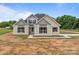 Charming home with a well-maintained lawn, a paved driveway, and a welcoming front porch in a rural setting at 4949 Rimer Rd # 4, Concord, NC 28025