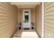 Inviting front porch with white door, full view window, and decorative potted plants at 4949 Rimer Rd # 4, Concord, NC 28025