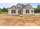 Charming two-story home with dark shutters, complemented by a large yard waiting for landscaping at 4949 Rimer Rd # 4, Concord, NC 28025