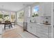 Bright kitchen with white cabinets, stainless steel appliances, and a view to the dining area at 4949 Rimer Rd # 4, Concord, NC 28025