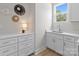 Bright laundry room with built-in cabinets and quartz countertops at 4949 Rimer Rd # 4, Concord, NC 28025