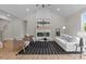 Inviting living room boasts soaring ceilings, a modern fireplace with a mantle, and large windows for ample natural light at 4949 Rimer Rd # 4, Concord, NC 28025