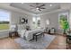 A bedroom is awash in light, has tray ceilings, neutral decor, and large windows offering a serene view at 4949 Rimer Rd # 4, Concord, NC 28025