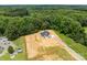 Aerial view showcasing modern farmhouse, adjacent lot, and mature trees at 4975 Rimer Rd # 1, Concord, NC 28025
