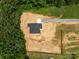 Aerial view of new construction home on a large lot surrounded by dense trees at 4975 Rimer Rd # 1, Concord, NC 28025
