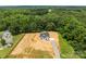 Expansive aerial view of new construction home with modern farmhouse design and wooded surroundings at 4975 Rimer Rd # 1, Concord, NC 28025