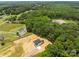 Aerial view of new home, mature trees, and driveway leading to property at 4975 Rimer Rd # 1, Concord, NC 28025