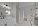 Bright bathroom featuring dual sink vanity with white cabinets, framed mirror and tiled walk-in shower at 4975 Rimer Rd # 1, Concord, NC 28025