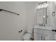 Bathroom featuring a white vanity and toilet with black hardware accents at 4975 Rimer Rd # 1, Concord, NC 28025
